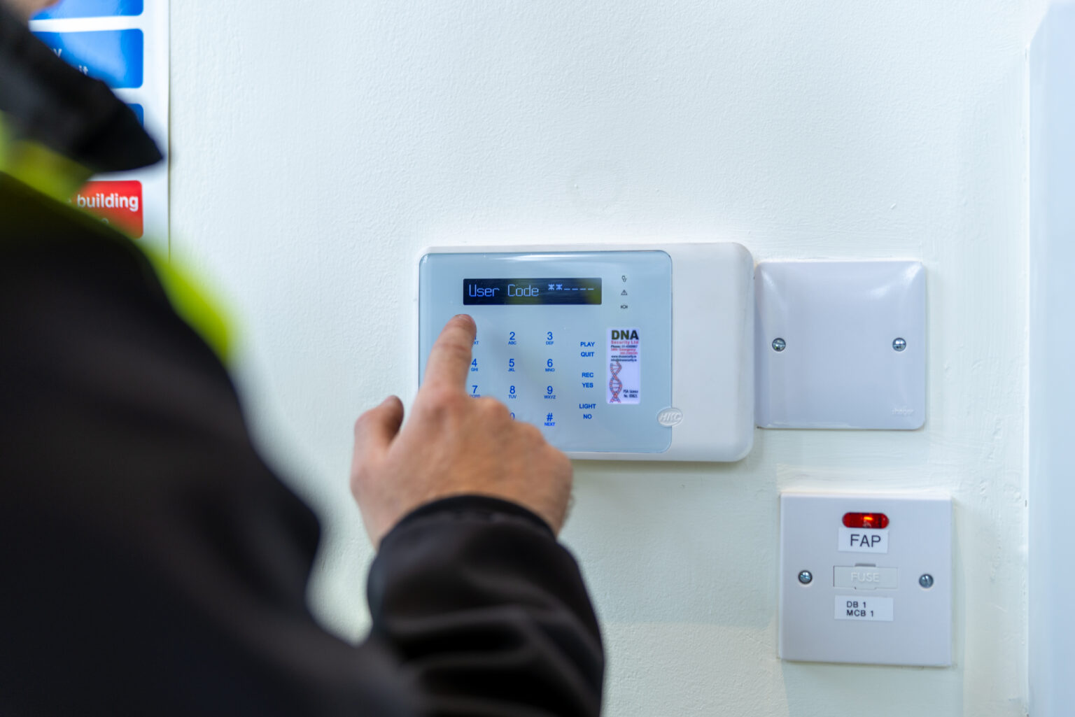 Setting an intruder alarm on a wall mounted control panel before the signal leaves the property