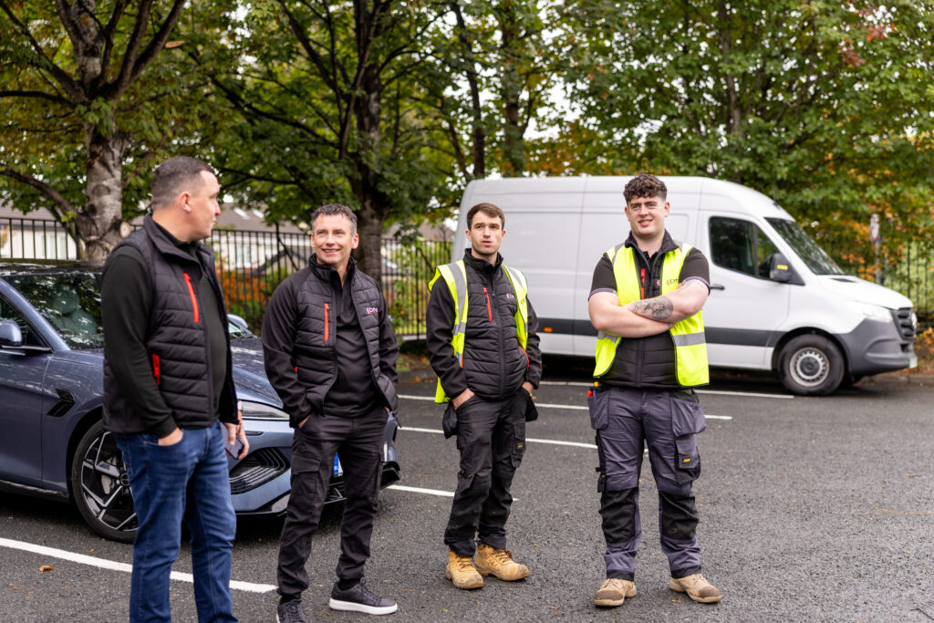 The DNA Security engineering team with a response van